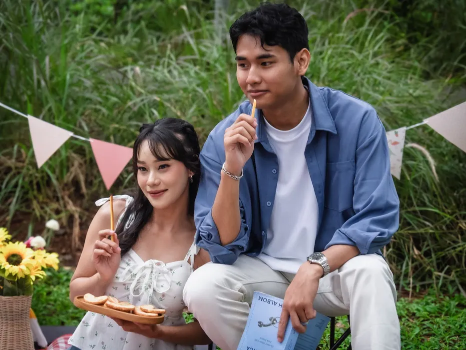 A couple having a picnic in a garden